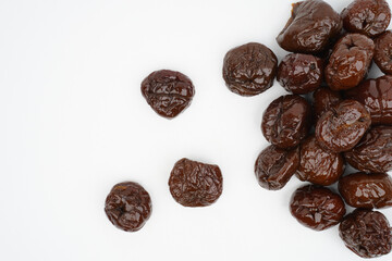Border of dried plums isolated background