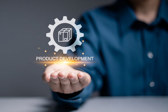 Product development concept. The process of inventing, designing and improving products or products to meet the needs of the consumer market. Person hold product development icon on virtual screen.