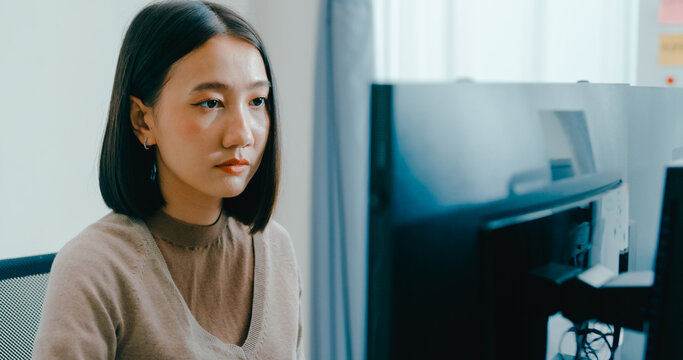 Young adult Asia female freelance typing write prompt AI bot IT app smart program nomad, video game, terminal with coding language, user interface, designer, big data center on desktop computer.