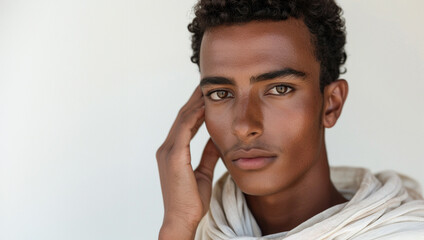 Obraz premium A portrait of an Egyptian woman skincare model in Cairo his hand softly touching his cheek