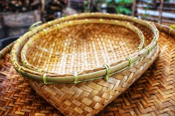 woven bamboo for household needs is placed on a white background. View of the saping made by hand