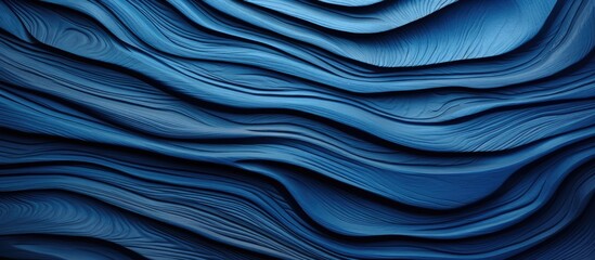 A detailed view of a vibrant blue wall featuring undulating wavy lines and patterns