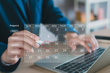 Calendar on the virtual screen interface. Businessman manages time for effective work.  Highlight...