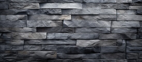 Close-up shot showing a sturdy wall constructed with gray stone blocks, emphasizing the texture and solid construction