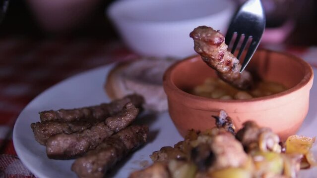 lula kebab is traditional cutlet made of minced lamb with spices, it is placed on a spit and grilled over charcoal. Dip meat in hot sauce