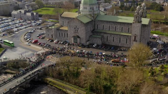 St. Patrick's Day Parade Near Galway Cathedral. Ireland. aerial pullback