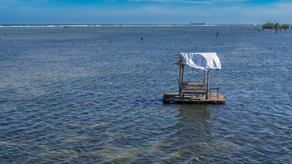 A wooden water platform for a romantic dinner is destroyed by a typhoon and floats in the ocean....