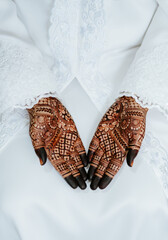 Bridal henna in white traditional kebaya for wedding