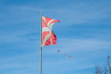Ikurriña, the flag of the Basque Country damaged by the weather in the fishing and tourist town of Pasaia in the Province of Guipúzcoa in March 2024
