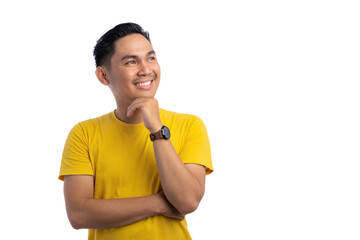 Happy Asian young man looking aside at empty space, touching chin, thinking of new good opportunities isolated on white background