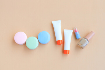 Cosmetic bottle containers isolated on beige background, Beauty products