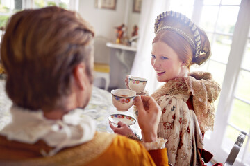 Royal man, woman and tea in castle with conversation, smile and vintage clothes with style in home....