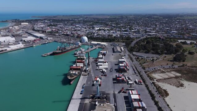 Container terminal in Timaru in new Zeleand loading cooled containers on a sunny day. Aerial view