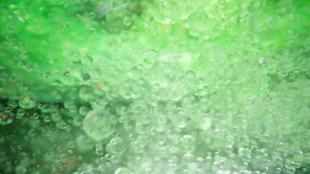 Green Bubbles Underwater, Macro Abstraction. Concept Of Adding Something To Water.