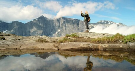 Mountains, lake or woman taking photograph on outdoor holiday vacation for blog or view. Photographer, environment or female person hiking in Norway for travel, tour or picture for memory in nature