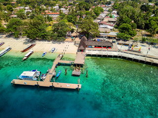 Tourist boats and ferries at the port on the small tropical island of Gili Air in Indonesia