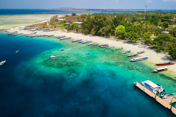 Tourist boats and ferries at the port on the small tropical island of Gili Air in Indonesia