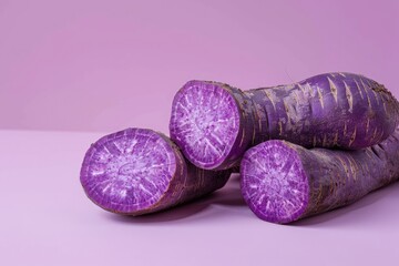 Obraz na płótnie Canvas Three Purple Carrots on Purple Background