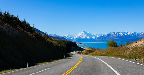 The  road way  travel with mountain landscape view of blue sky background over Aoraki mount cook national park,New zealand
