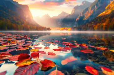 Foto op Canvas A picturesque autumn scene with vibrant red, orange and yellow leaves floating on the surface of an tranquil lake surrounded by tall mountains under a sunset sky © Kien