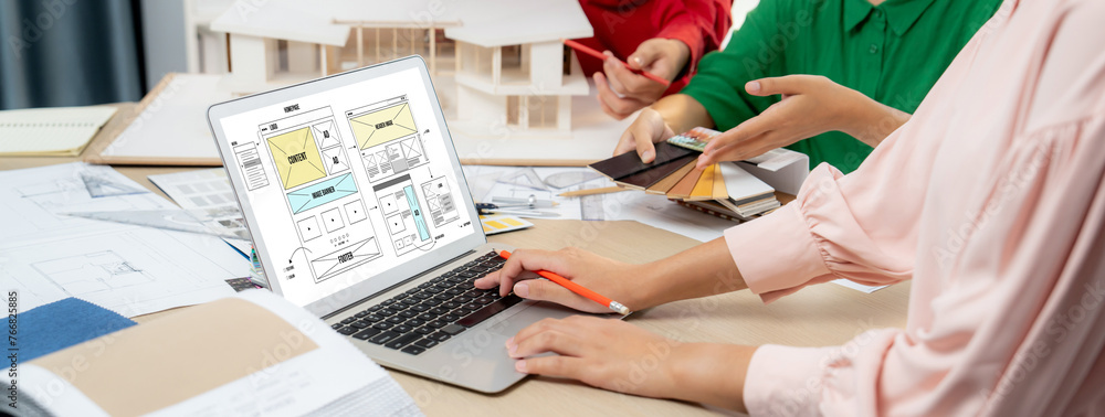 Poster cropped image of interior designer team discuss the material color while laptop displayed website wi