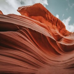 A magnificent canyon with layers of red and orange rock formations, carved by the forces of nature over millions of years.