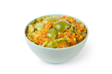 Stewed green tomato salad in a bowl on a white background. Homemade vegetable salad.