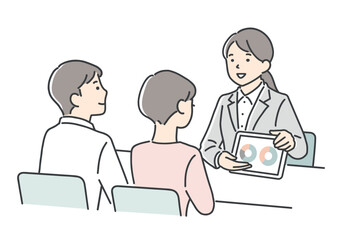 若いカップルに案内をする営業担当者