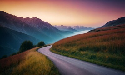 A road winds through a grassy field with mountains in the background. The sky is a mix of pink and orange hues, creating a serene and peaceful atmosphere - 766848810