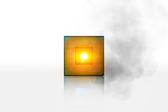 Computer processor chipset CPU overheats and burns with smoke around. CPU processor isolated on white background.