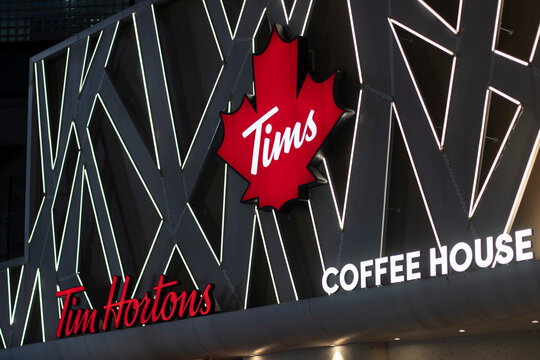 Ningbo, Zhejiang, China - July 9, 2023: Tims logo is seen at one of its coffee houses in Ningbo, China. Tim Hortons, Inc. is a multinational coffeehouse and restaurant chain based in Toronto, Canada.