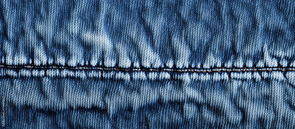 Aufkleber an up-close image showcasing a pair of jeans with intricate stitching patterns on the fabric
