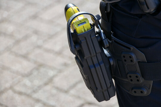 Taser electric shock weapon on a police officer's belt