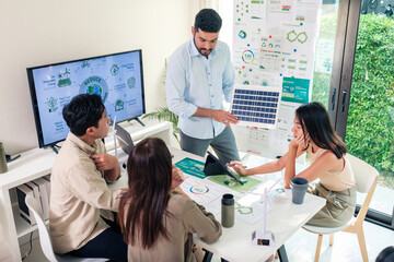 Diversity team presentation new design solar cell panel renewable energy innovation at office - 766857224