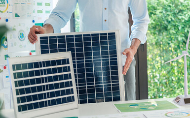 Diversity team presentation new design solar cell panel renewable energy innovation at office - 766857263