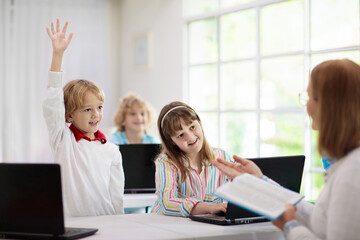Fototapeta na wymiar Online remote learning. School kids with computer.
