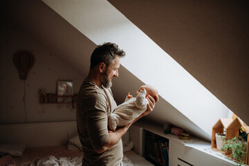 Father holding his newborn baby. Unconditional paternal love, Father's Day concept. - obrazy, fototapety, plakaty
