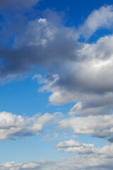 Blue sky background with clouds.Copy space. Vertical photo. Background.