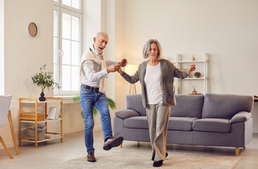 Senior couple dancing, cool happy dance, active older adults express enjoyment, nice elderly...