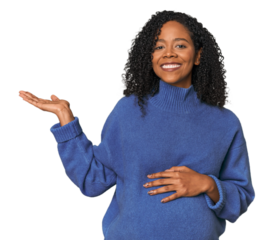 Pregnant African American woman in studio showing a copy space on a palm and holding another hand on waist.