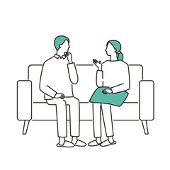 ソファで話し合う若い夫婦