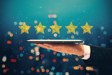 Close up of businessman hand holding tablet with 5 star rating on blurry night city background. Customer service and excellent feedback concept.