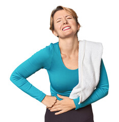 Caucasian woman in sportswear with towel having a liver pain, stomach ache.