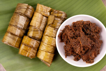 High angle view of beef rendang and lemang