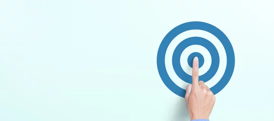 Tuinposter Target concept with Hand of the businessman pressing target icon © Worawut