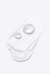 cosmetic smears cream gel texture on a light background