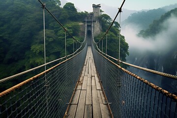 Obraz premium Suspension bridge enveloped in mist over a forest, Generated AI.
