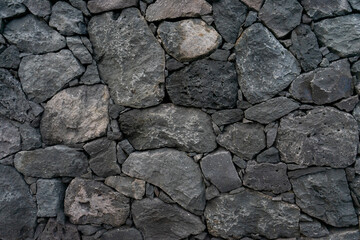 Traditional volcanic rock wall from the Azores, Portugal. Authentic island craftsmanship captured in stunning detail.