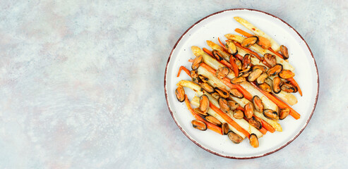 Seafood salad of roasted mussels with asparagus, copy space.