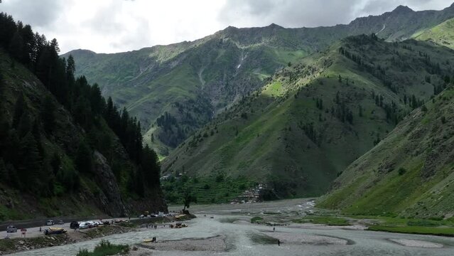 Drone shot starts close on a spirited rafting group in Naran&rsquo;s rivers before pulling away to unveil the majestic surroundings, marrying the essence of adventure with the serenity of nature